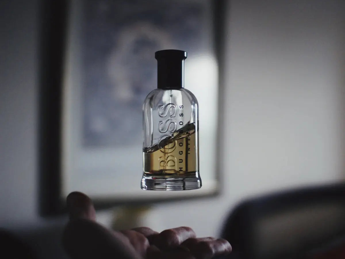 shallow focus photography of floating perfume bottle